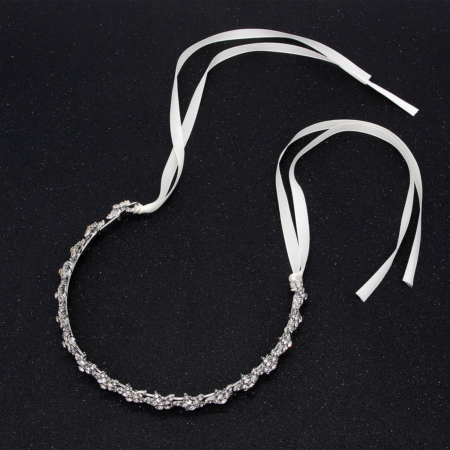 Silver headband with ribbons on a black background